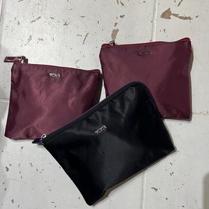 1 Tumi pouch with travel essentials